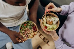 man and women eating healthy food