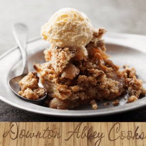 a photo of a delicious serving of apple crumble with a heavy scoop of ice cream.