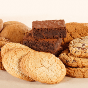 plate full of brownies and cookies.